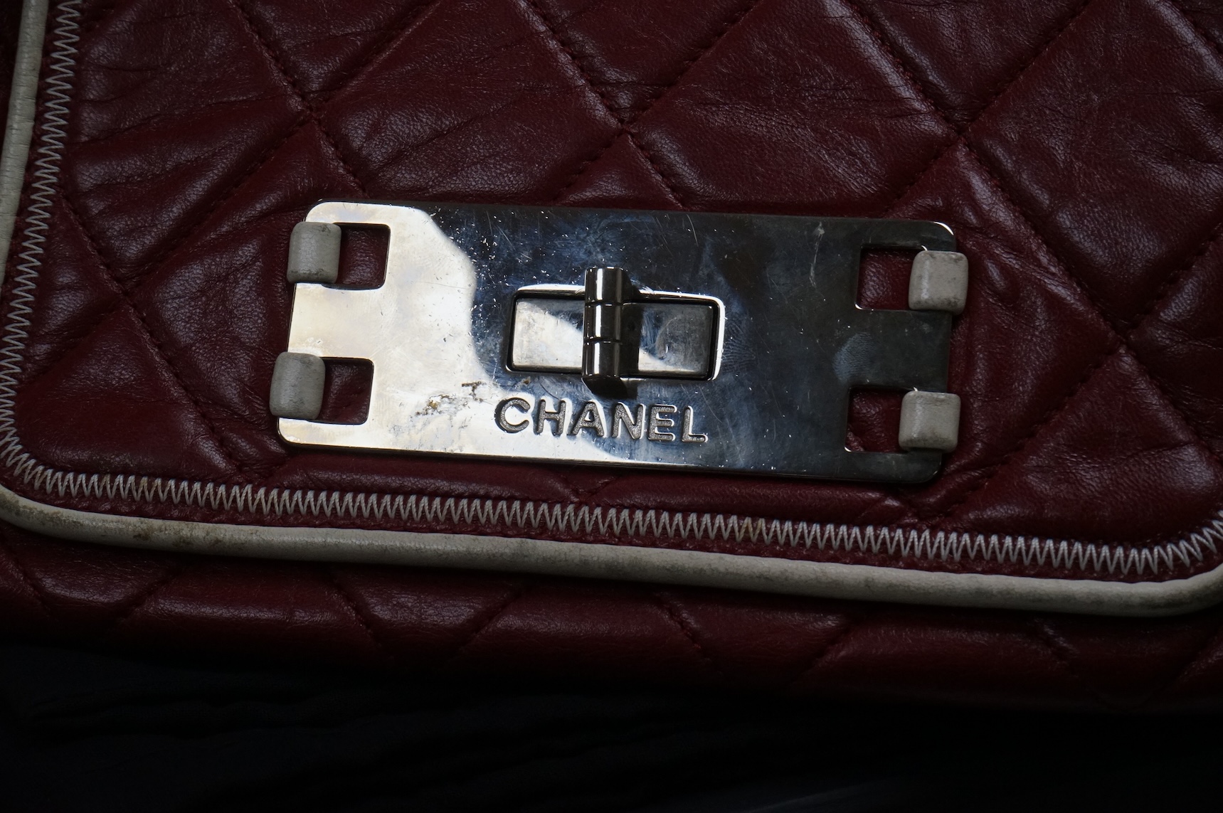 A Chanel East West dark red quilted leather flap shoulder bag with silver hardware, date code 12115484, with original receipt, dust cover and box, 35cm wide, Provenance: purchased by the vendor in Selfridges
